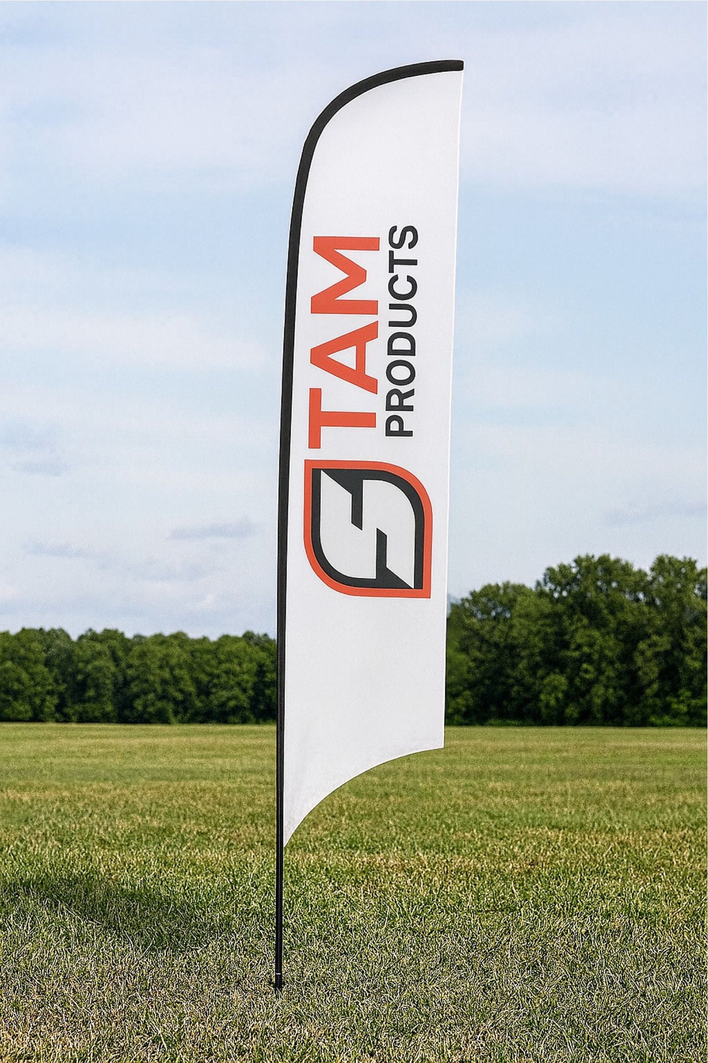 Stam Products Bespoke Printed Branded Arc Flag Banner with logo on white fabric standing outdoors on grass field