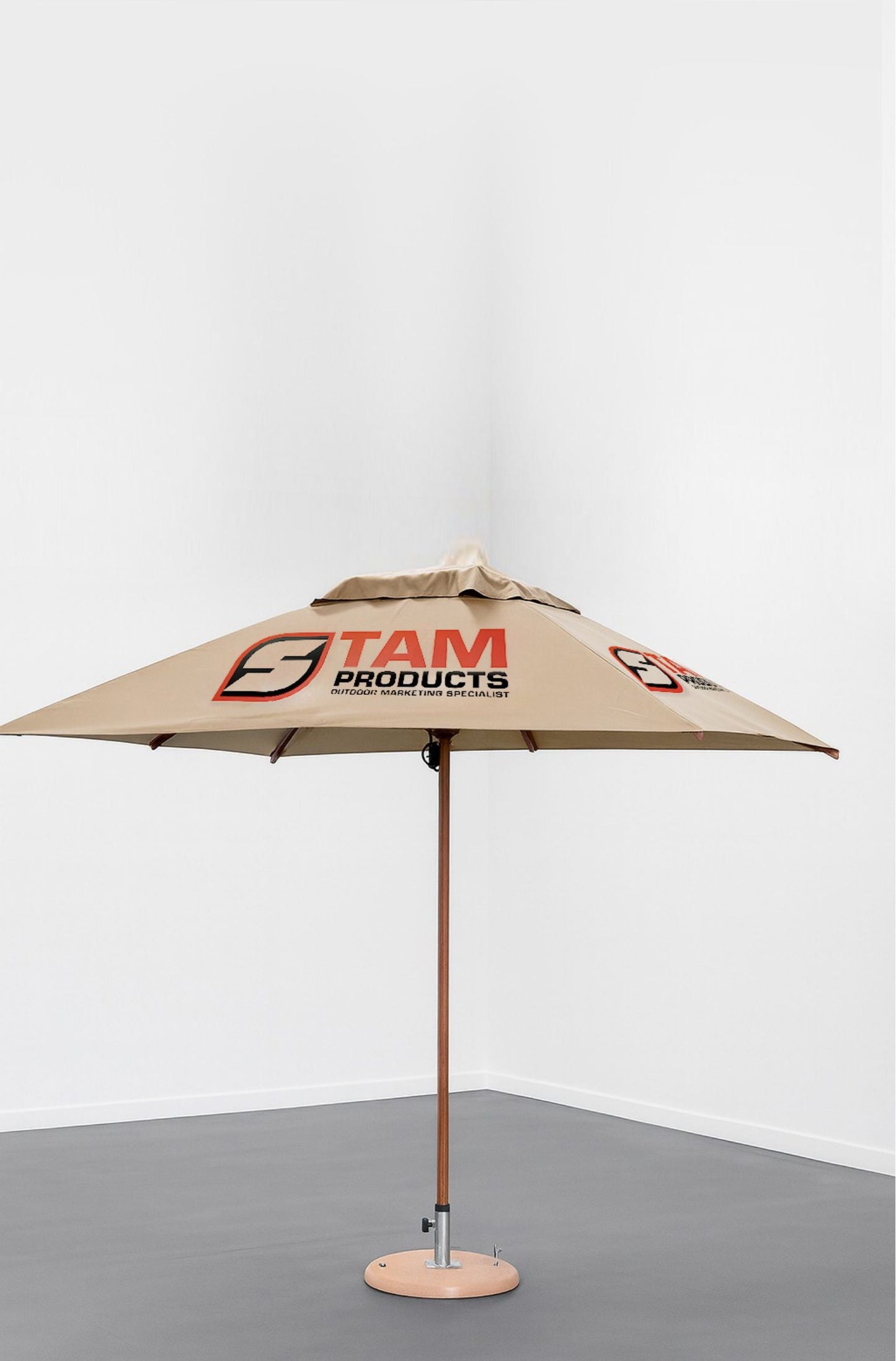 Custom printed branded square umbrella by Stam Products with beige canopy and logo, designed for durable outdoor branding.