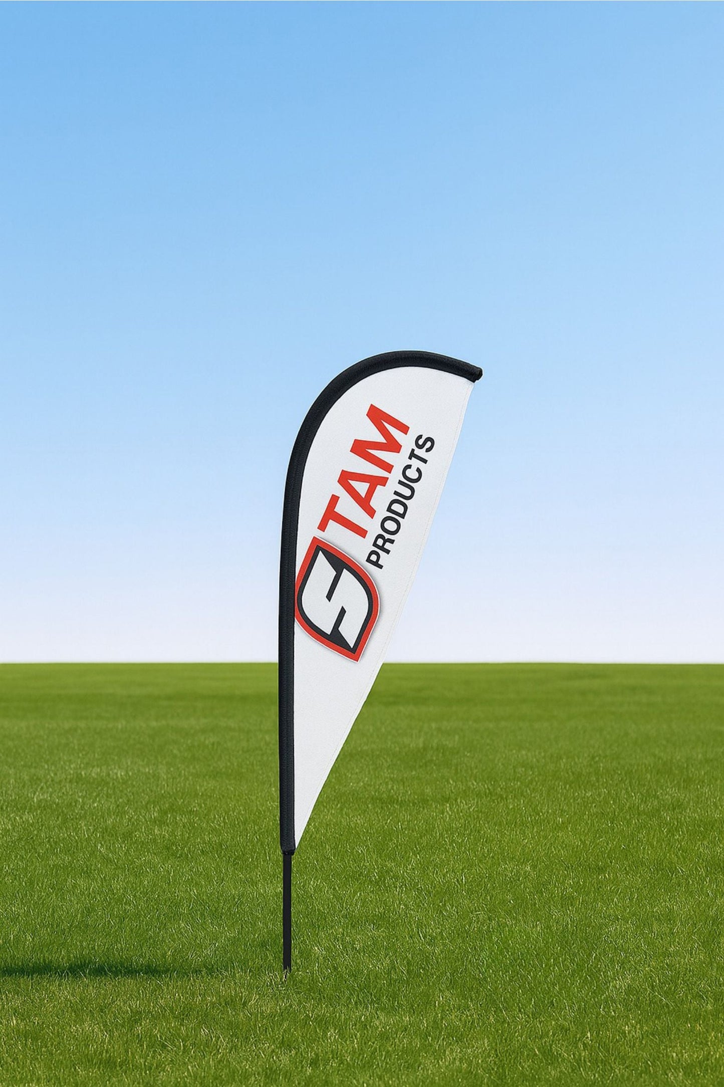 Custom printed Stam Products branded white fin flag banner on green grass with blue sky background