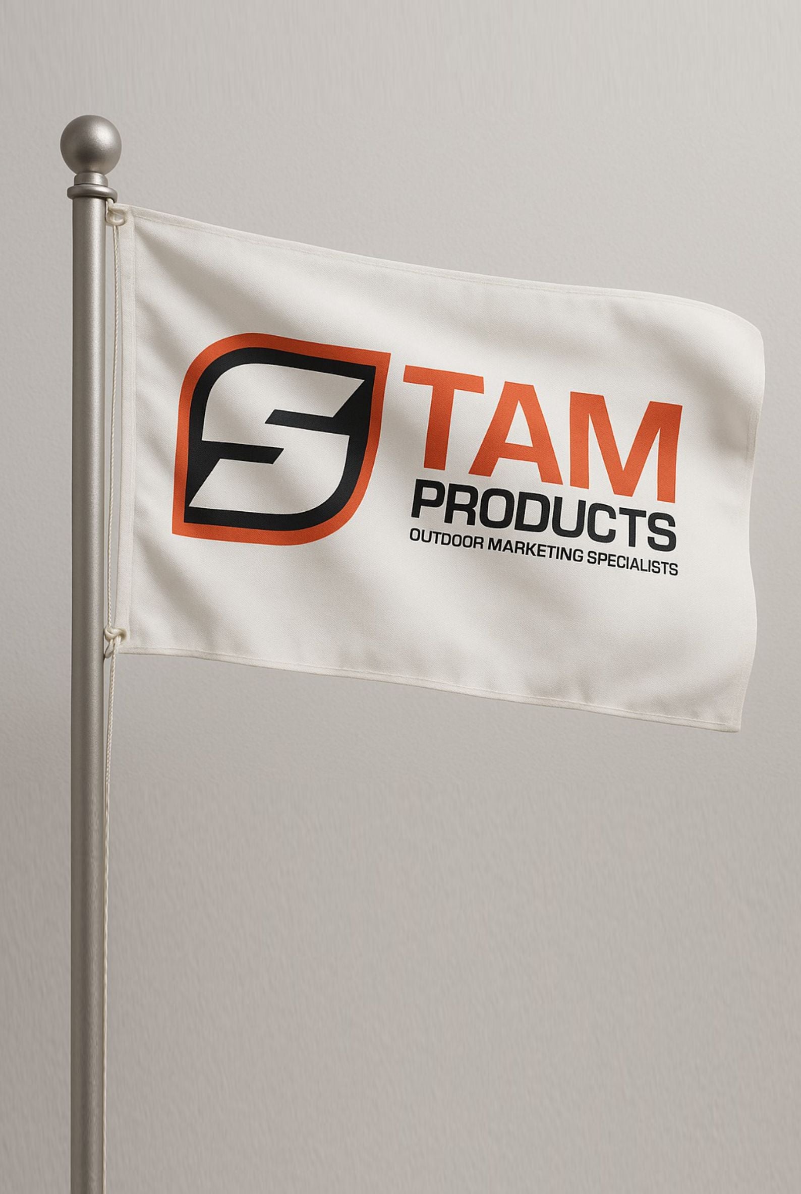 Custom branded corporate flag by Stam Products with logo on white polyester fabric fluttering on a silver pole