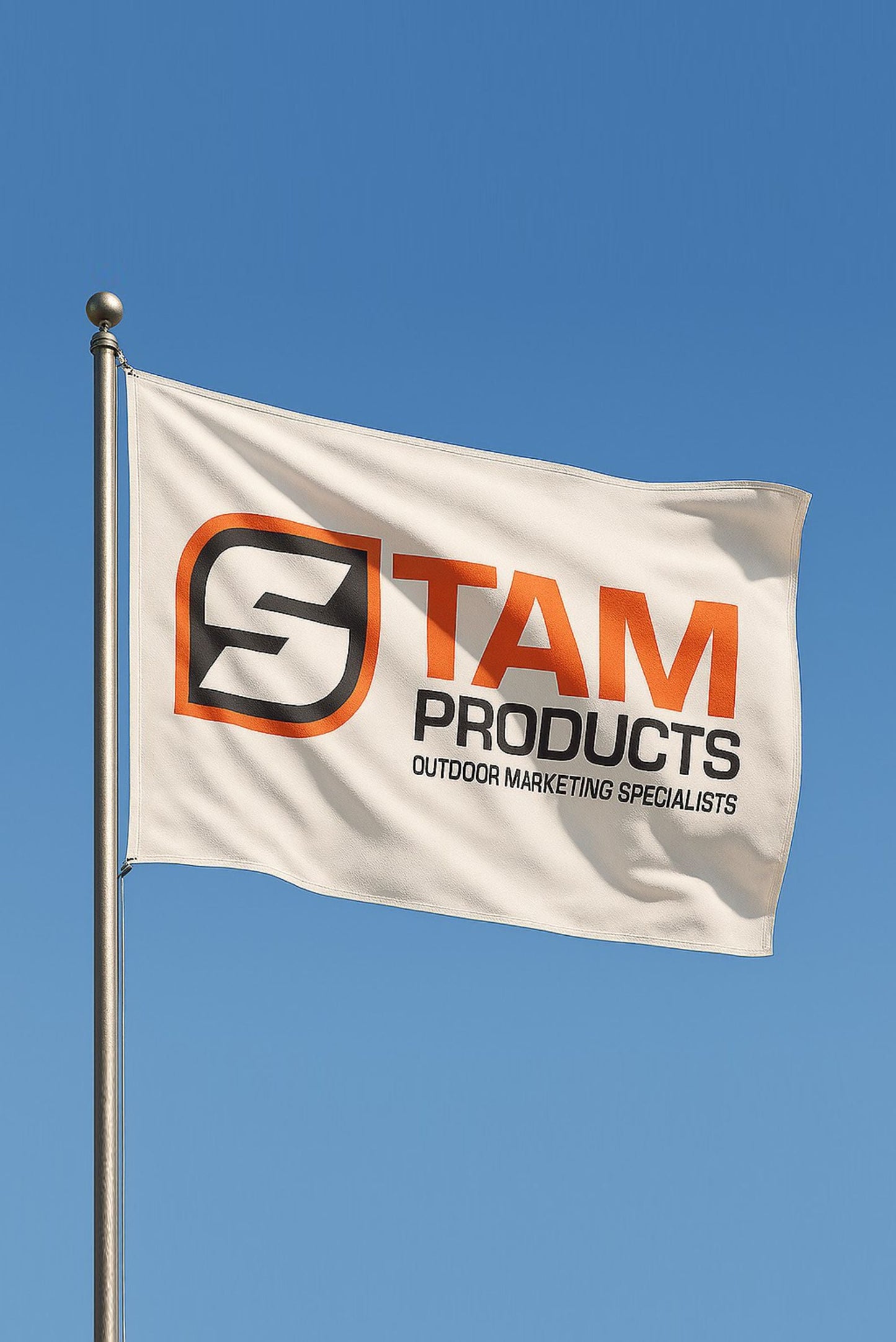 Stam Products high quality custom branded corporate flag flying outdoors on a metal pole against clear blue sky