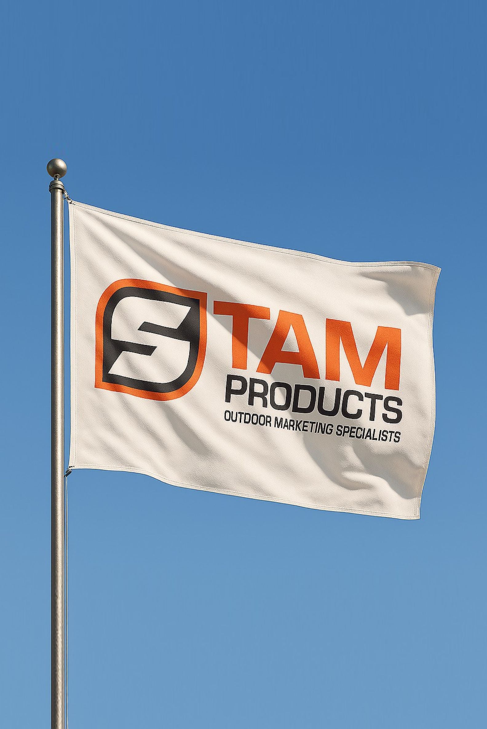 Stam Products high quality custom branded corporate flag flying outdoors on a metal pole against clear blue sky