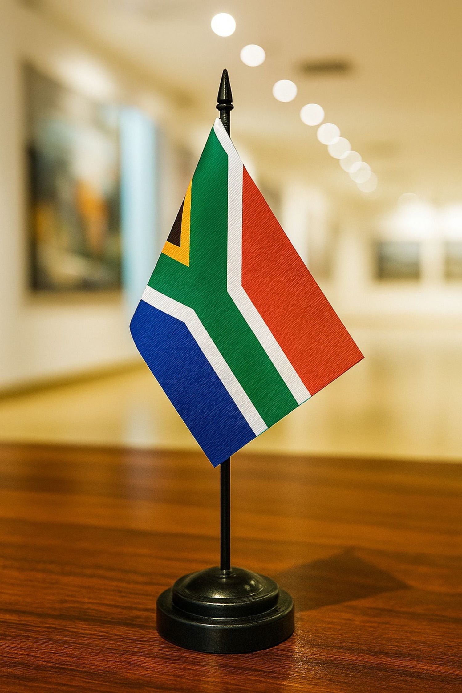 Stam Products high quality custom printed South African country flag on a desk stand with black pole.